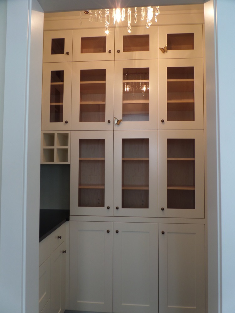 Walk-in pantry for large custom kitchen.